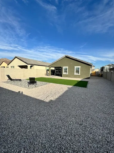 Backyard turf and paver patio installation